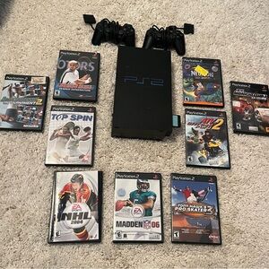 Sony PlayStation 2 Console with Black Controllers and Game Collection